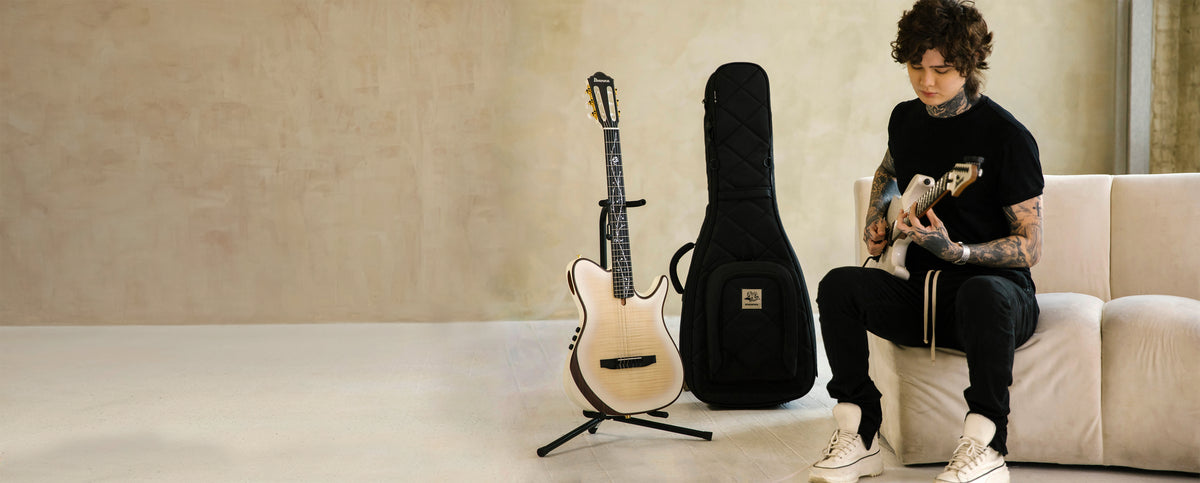 Tim Henson playing guitar next to the MONO x Tim Henson M80 Classic Dual Electric Guitar Case | MONO